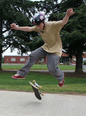 skateboarder performing a 360 flip